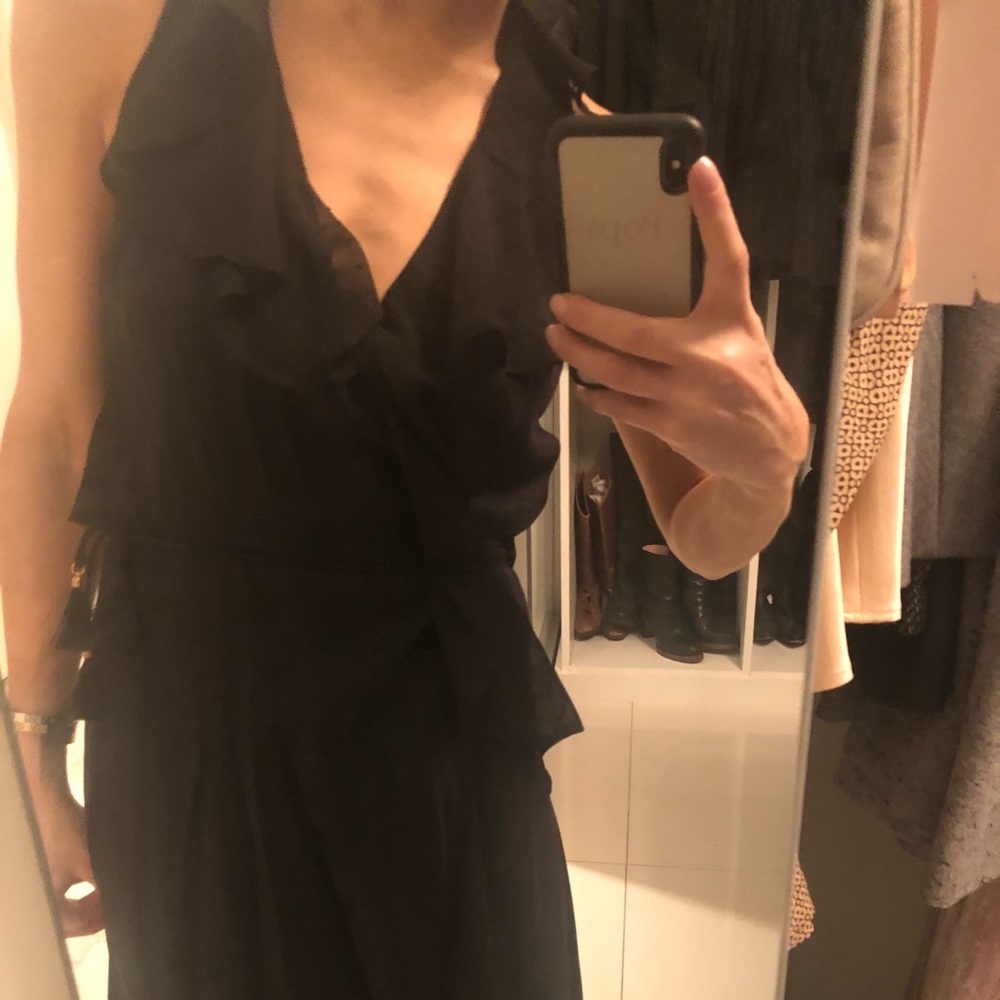 Black wrap dress with ruffles and gold detail